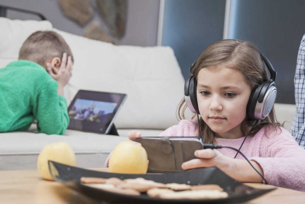 Therapist conducting virtual ABA session on laptop with parent involvement